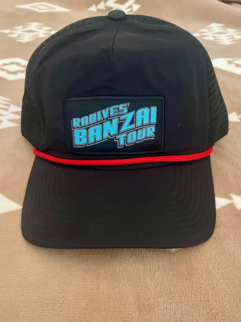 Flylow Rahlve’s Banzai Tour Black Snap Back Trucker Hat.
